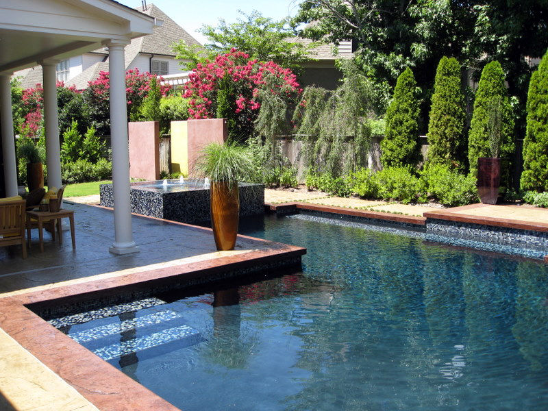 A custom pool with landscaping creates a relaxing environment.