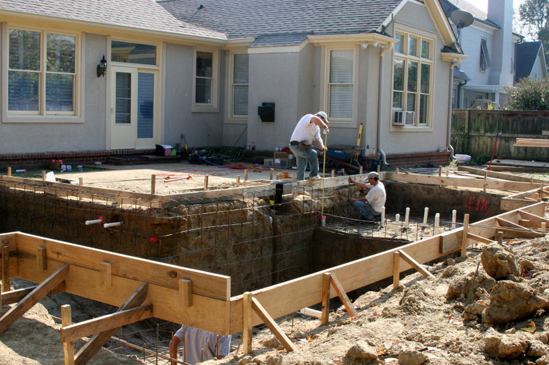 Rich-Way Landscape crew preparing custom pool construction site for concrete.