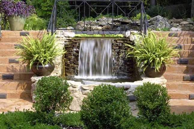 Custom waterfall with natural stone construction.