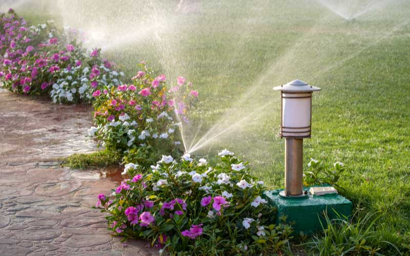 Irrigation system providing flower beds with water.