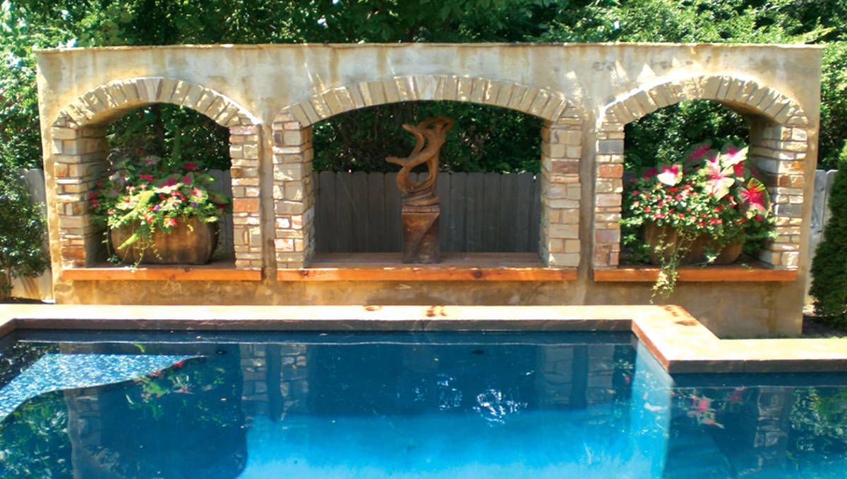 A popular hardscape adored by homeowners is a custom brick wall.